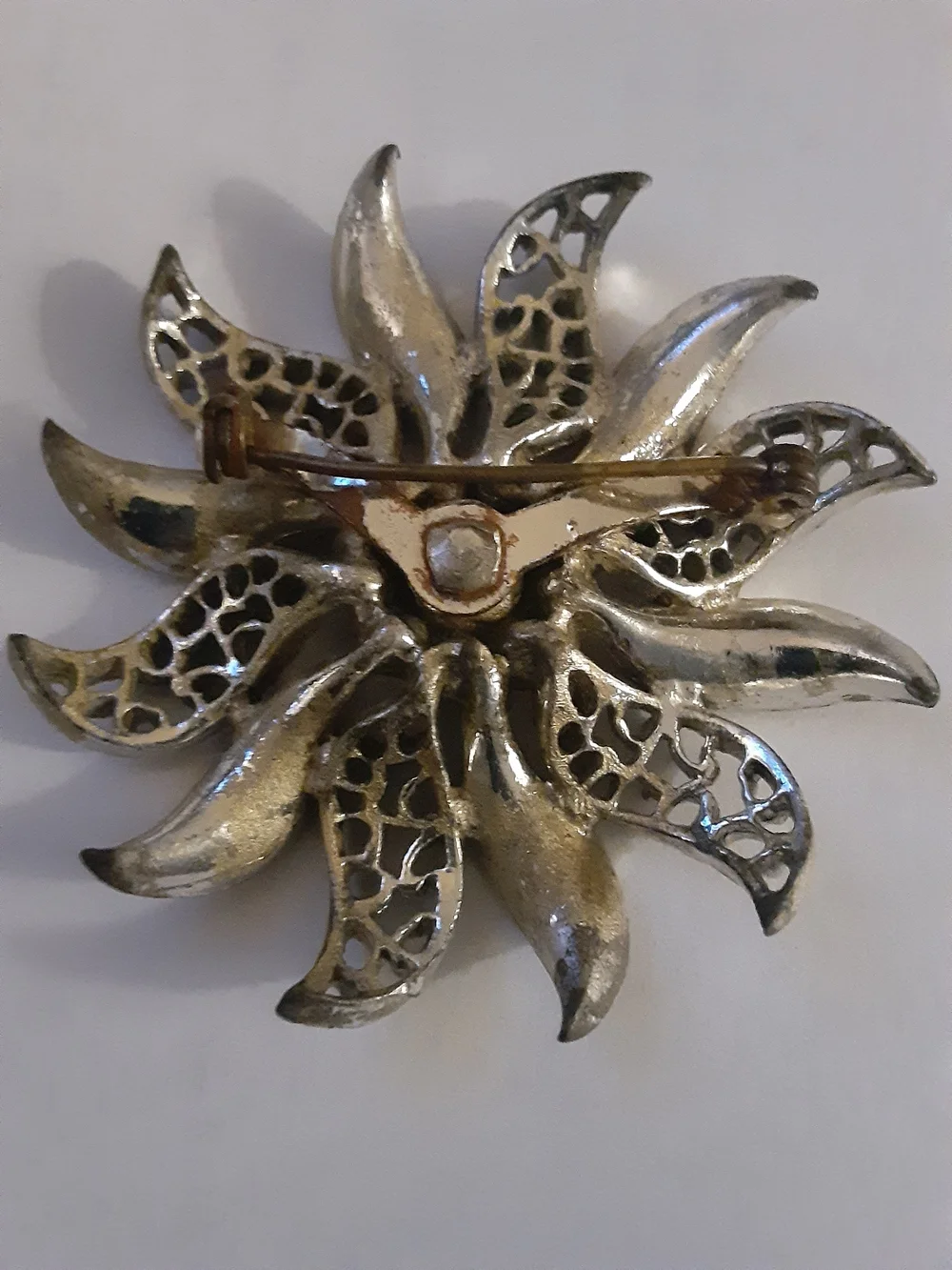 Vintage Pewter Tone Floral Brooch with Red and Clear Rhinestones